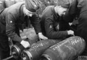 Members of the Polish forces in the British Army inscribe bombs destined for Germany on 29 July 1944: "Maryśka, nie zapomnij o Adolfie" - "Mary, don't forget Adolf".